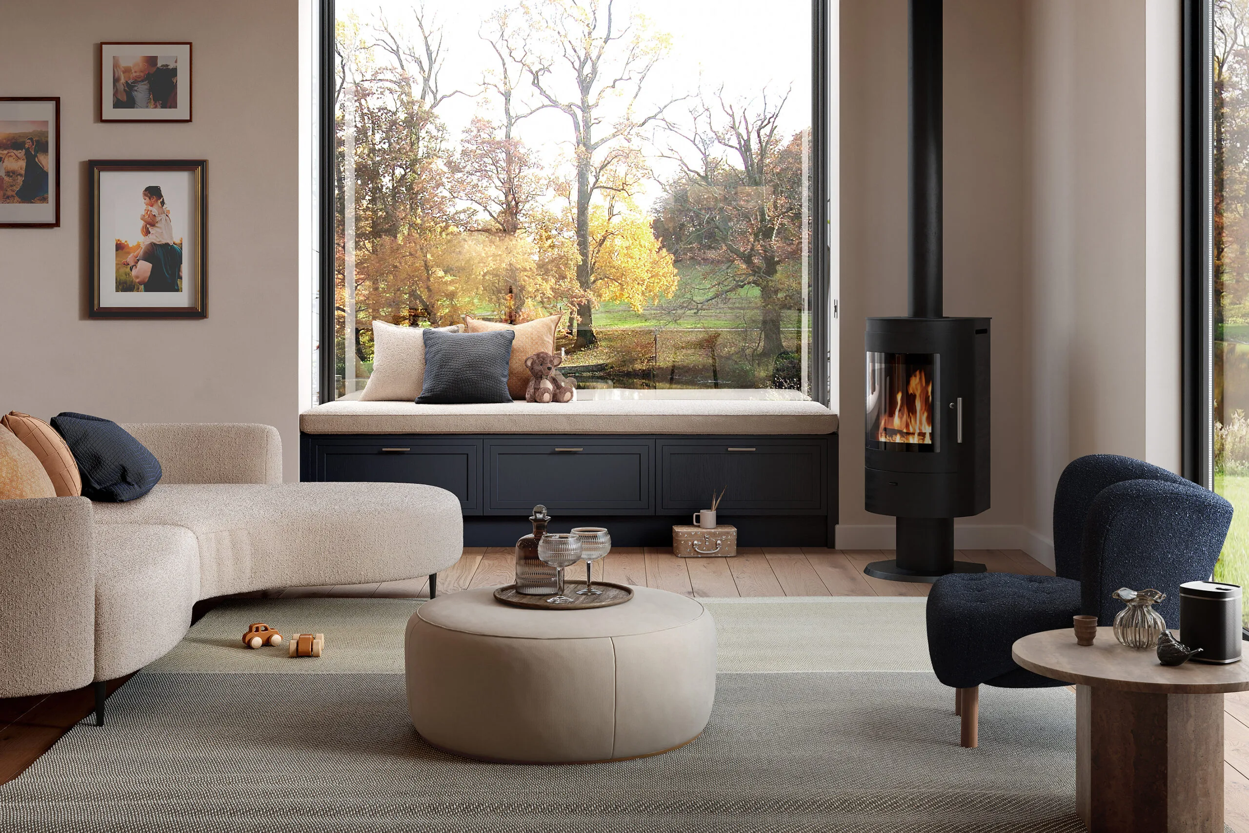 Living room with wood burning stove, curved sofa and garden view