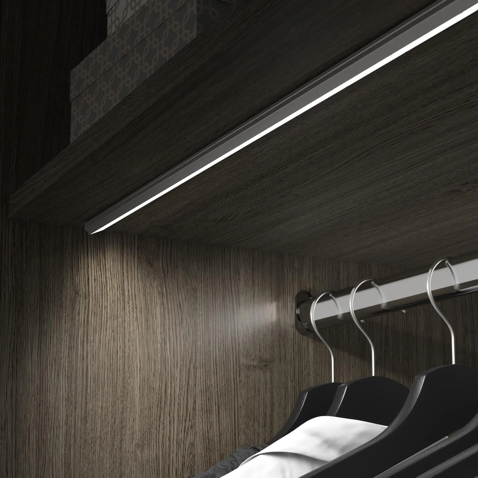 Wardrobe interior with LED lighting rail and hanging space