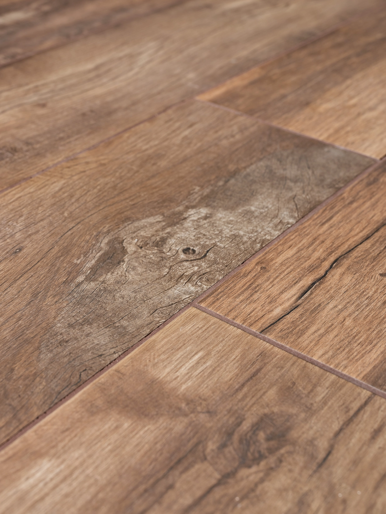 Wood effect porcelain plank flooring in warm brown